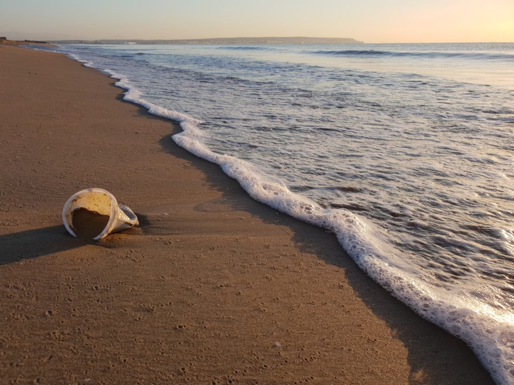 plastic cup on the beach